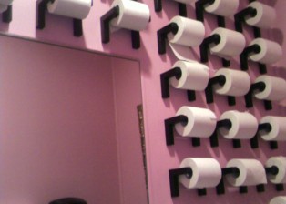 Lucky China bathroom with lots of toilet paper rolls on the wall